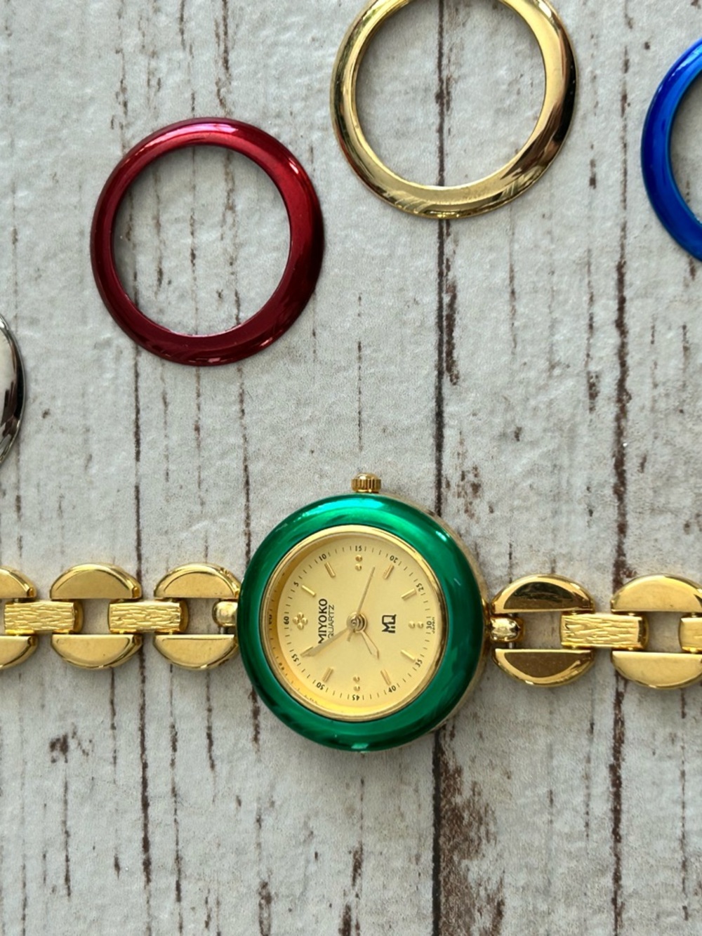 Miyoko Interchangeable Bezel Gold Bracelet Watch with Green Bezel